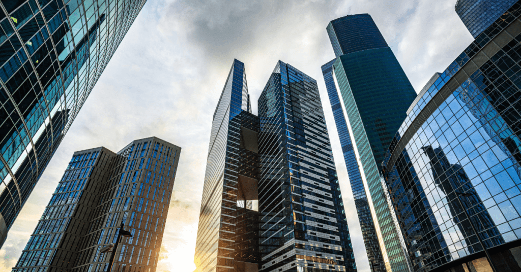 large corporate buildings in a city representing Governance in ESG Investing