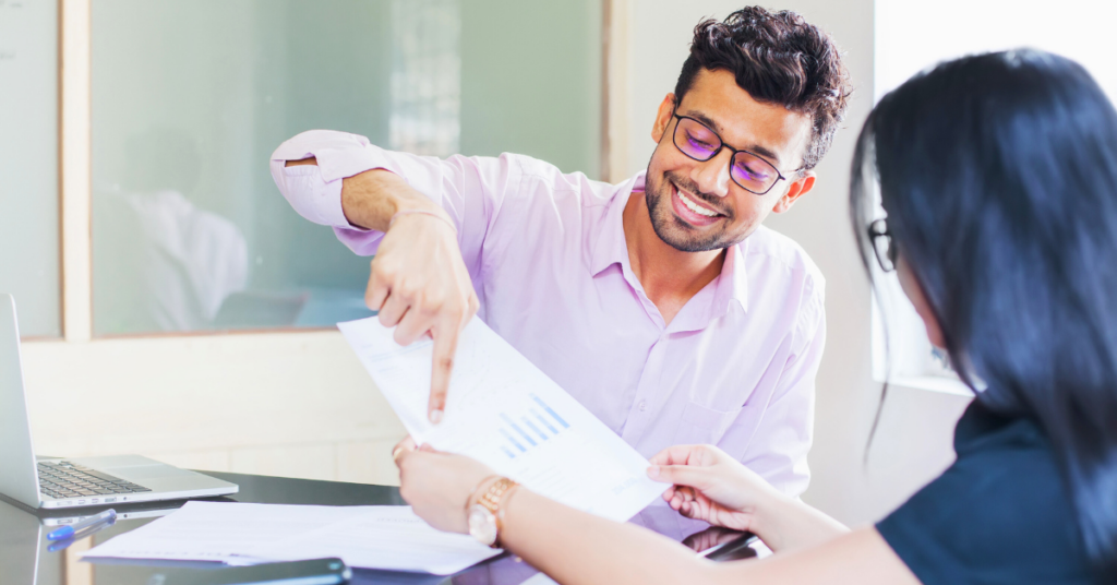 man and woman in office discussing sustainable investing values