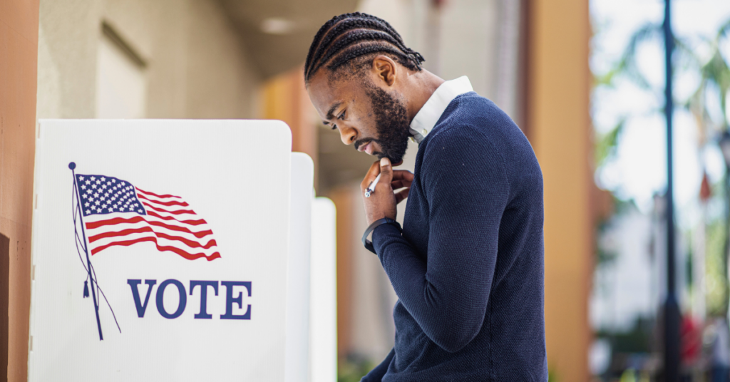 man at his polling location voting